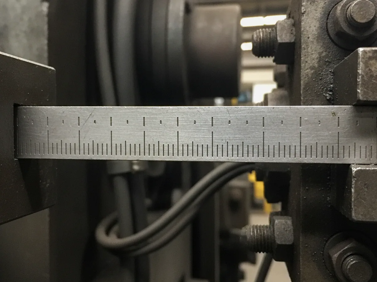 Graduated measuring scale, close up — the axes a construction machinery seat is compared on