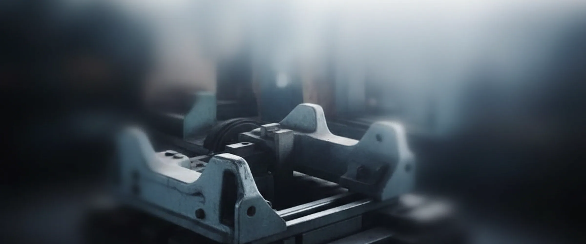Rail slide assembly for an excavator seat base